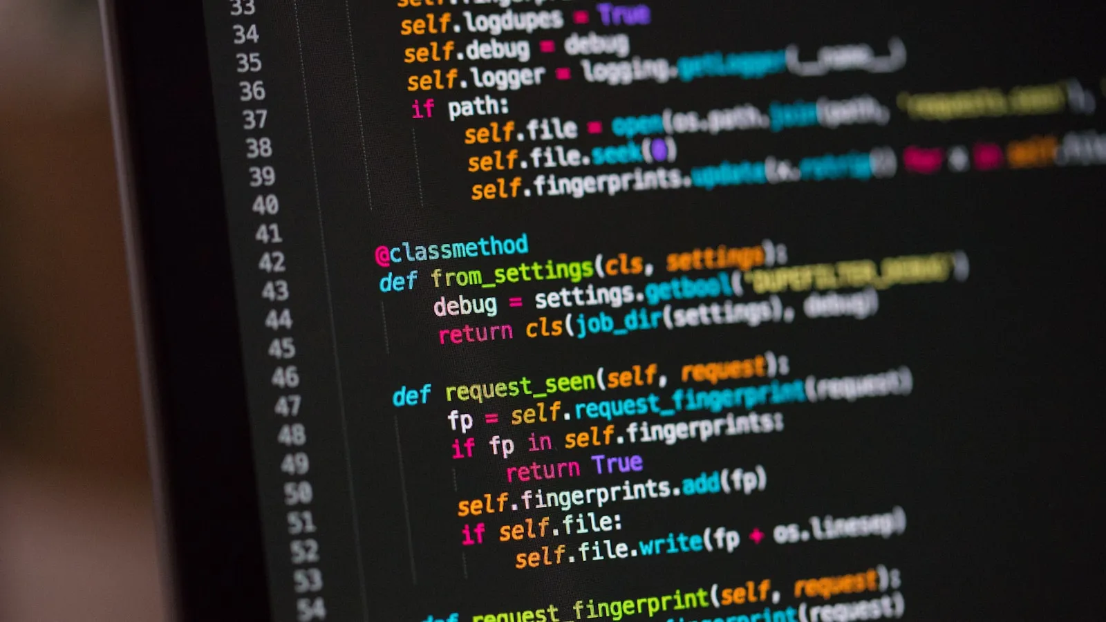 Close-up of code on a dark screen